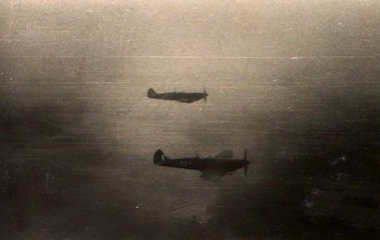 Spitfire fighter escort photographed from “Sister Ann” flying through Monsoon weather to Imphal, 9/10 September 1944 [MB2/N12]