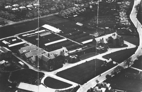 Aerial photograph of the Highfield campus with the wooden huts at the rear of the main buildings, c.1932