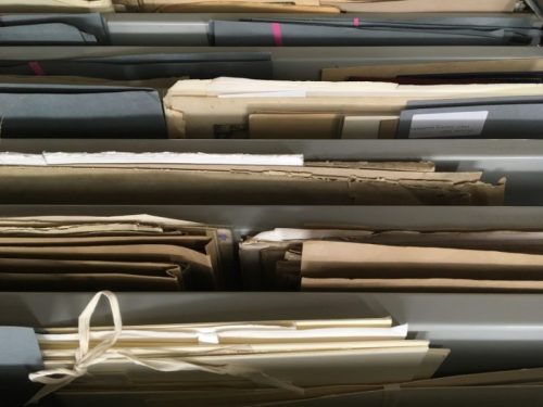 Original folders stored on archives shelving