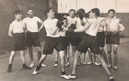 Boys boxing in the roof playground of the Bernhard Baron St George’s Jewish Settlement, 1930s [MS 132 AJ 220/2/4 f.3]
