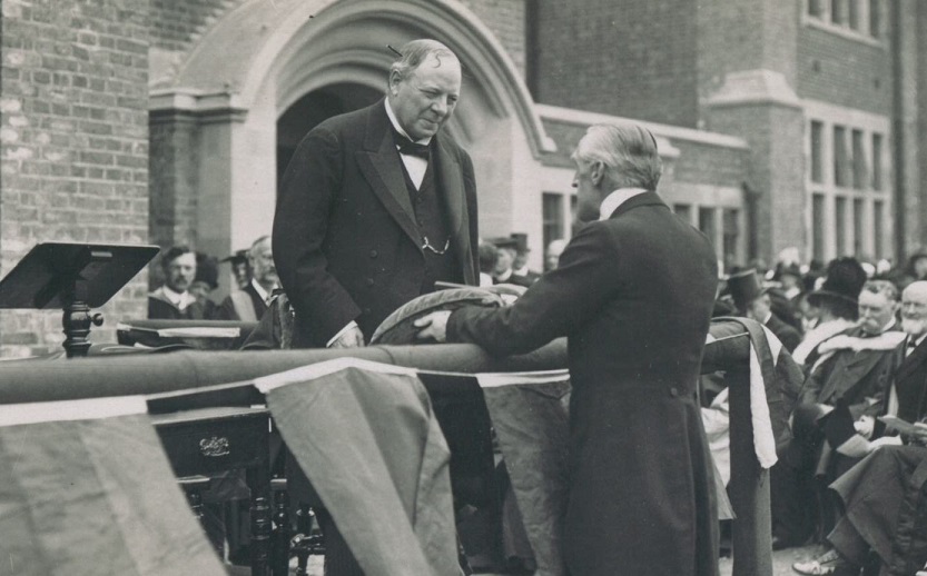 The architect presenting the keys to Lord Haldane at the official opening of the Highfield buildings, 1914 [MS1/2/5/17]