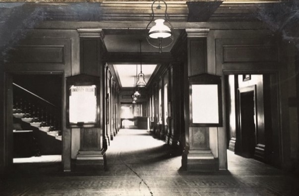 photograph of Hartley Institution entrance hall showing door to Shore's office on the right